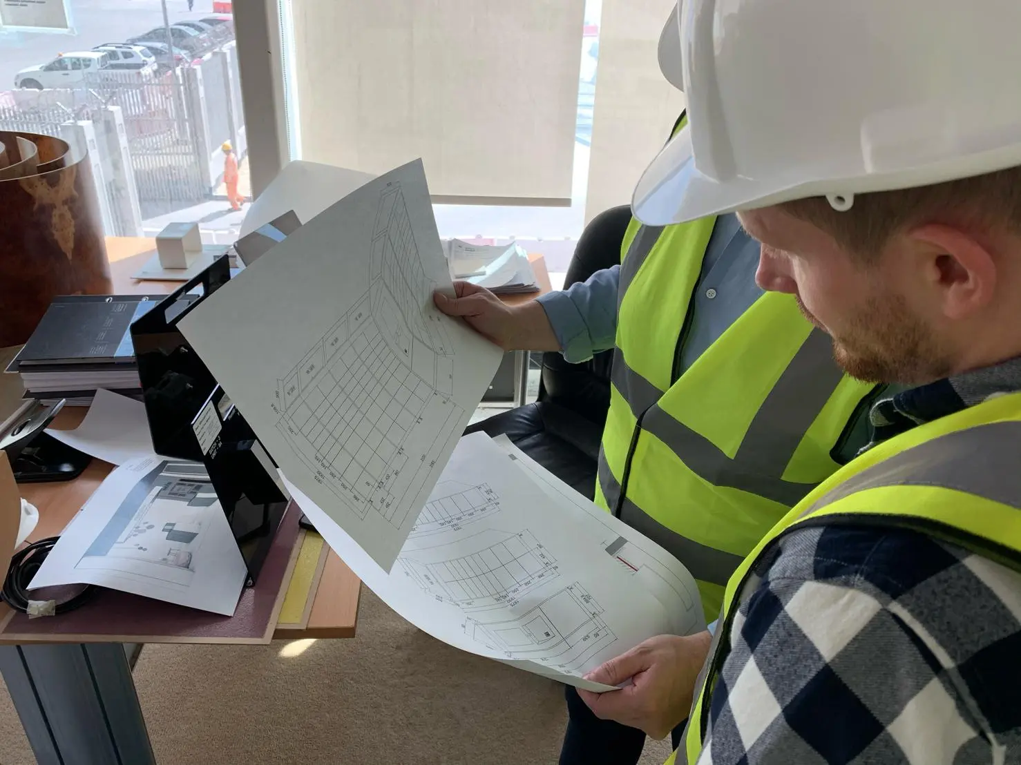 Reviewing locker blueprints on-site in Bahrain