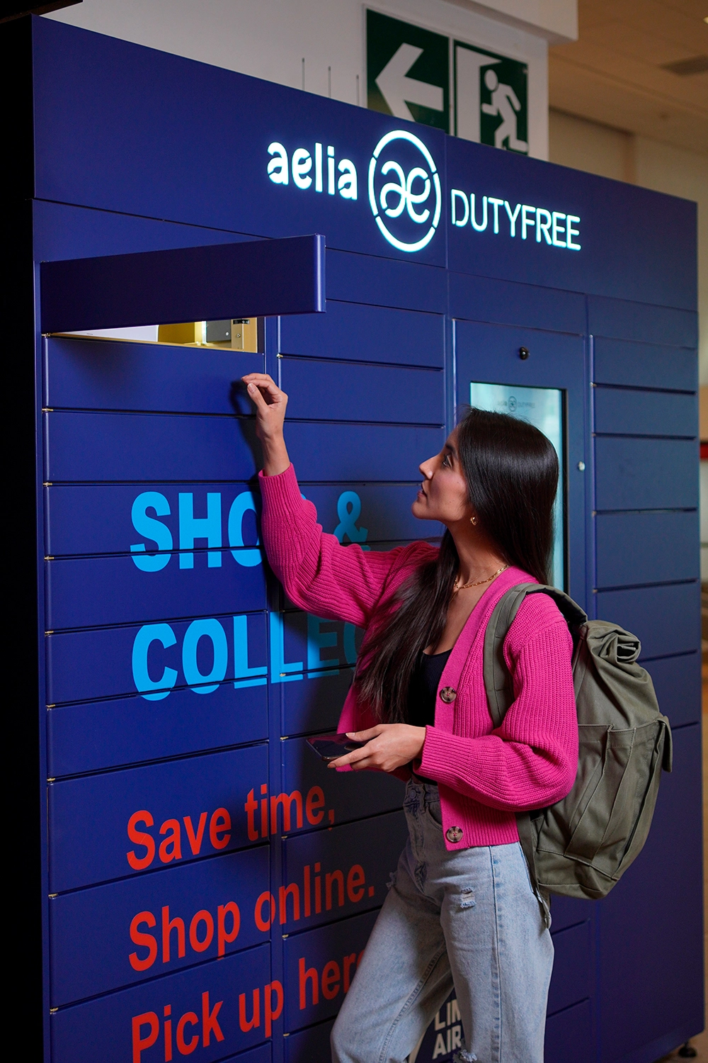 Customer reaching into opened compartment to collect their order